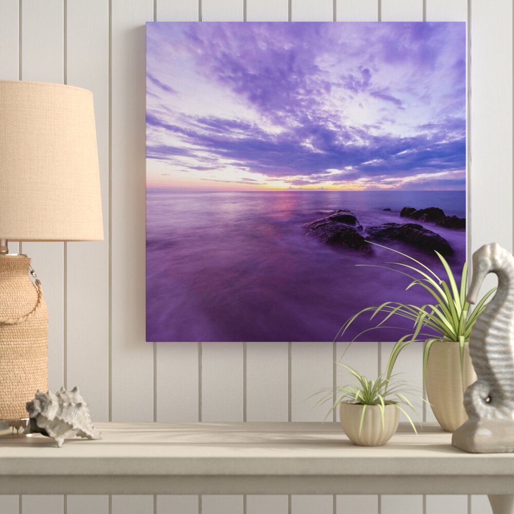 Leinwandbild Violette Meerlandschaft mit Felsen