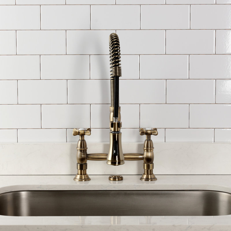 Kingston Brass Essex Double-Handle 2-Hole Deck-Mount Pre-Rinse Bridge Kitchen Faucet, Antique Brass