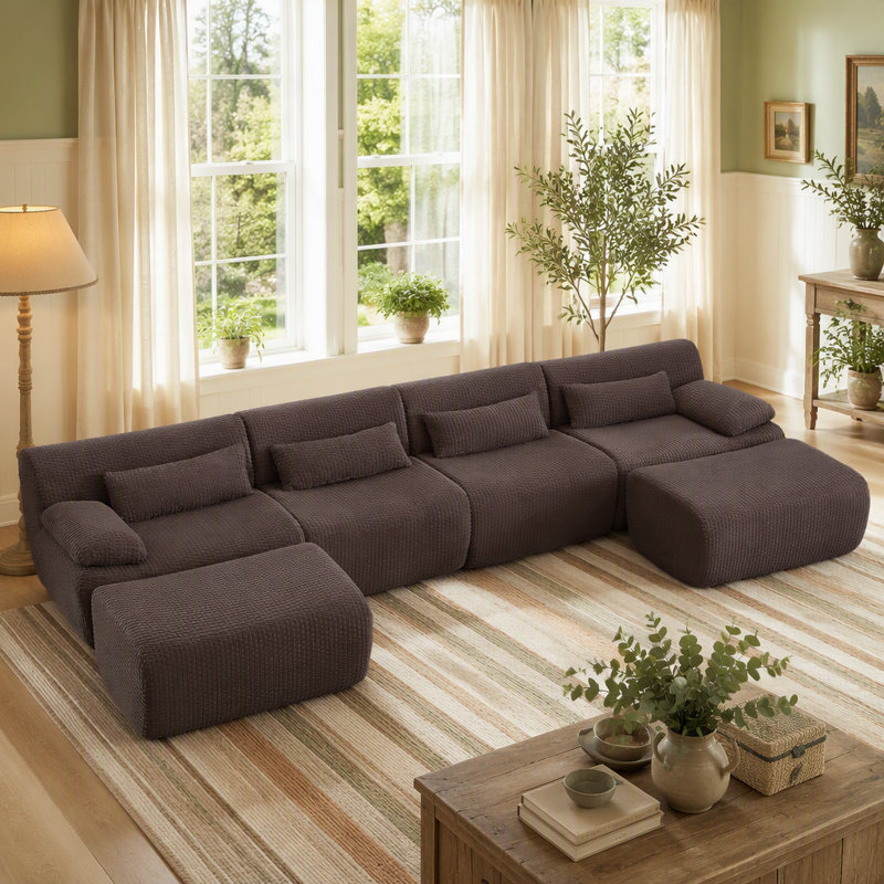 Canapé d'angle convertible en forme de U avec pouf pour salon, offrant un confort moelleux, une flexibilité permettant de gagner de la place et une utilisation immédiate sans assemblage.
