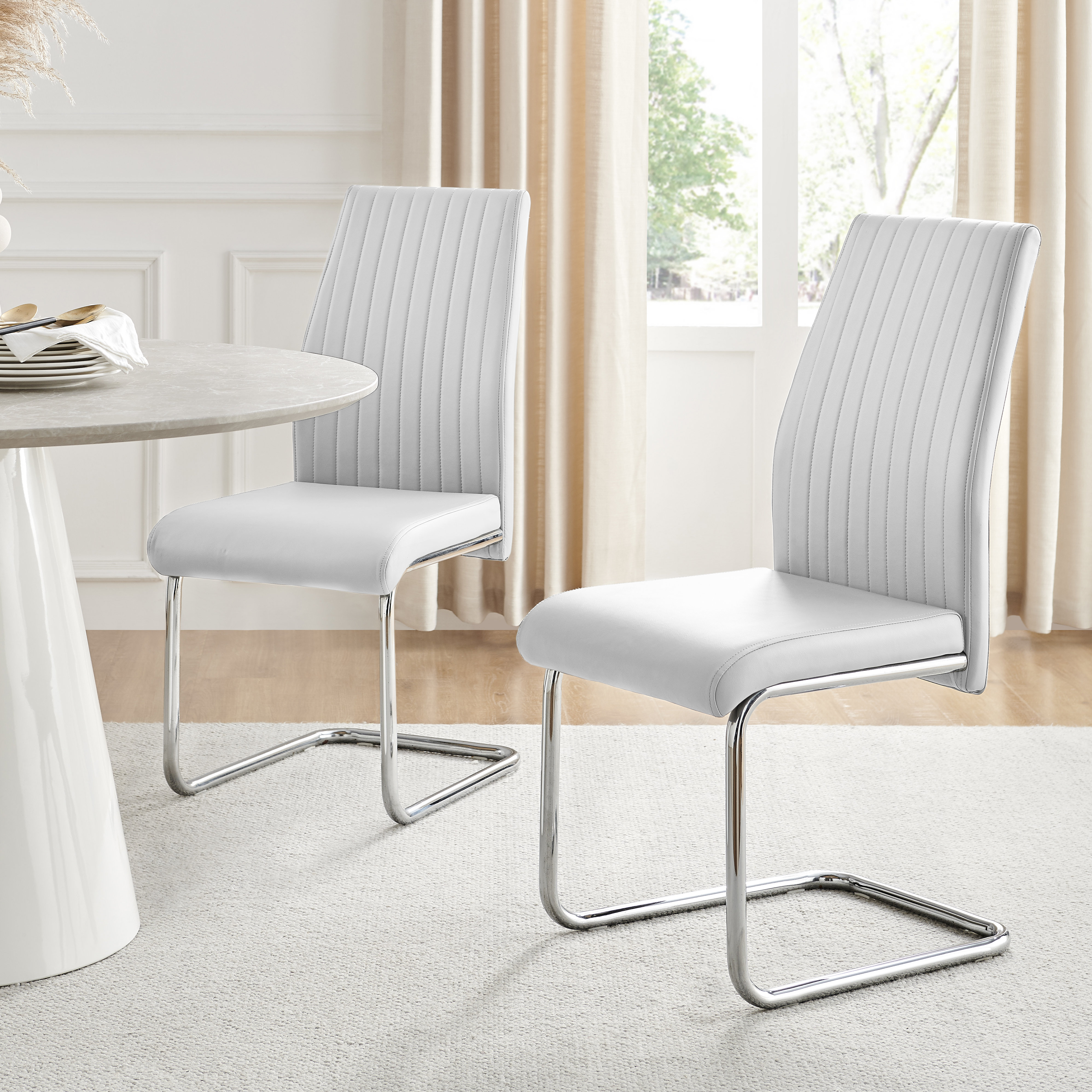 https://assets.wfcdn.com/im/56943657/compr-r85/2712/271210185/lorenzo-modern-padded-faux-leather-chrome-leg-kitchen-dining-chairs-modern-design.jpg