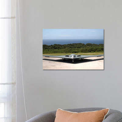 A B-2 Spirit Stealth Bomber Waits on the Flightline 1 Piece Wrapped Canvas Wall Art
