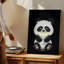 Toile, un joli panda de style dessin animé avec de la fourrure noire et blanche moelleuse est assis dans un environnement sombre tenant une tasse brillante pour l'art mural moderne sur toile-175495529