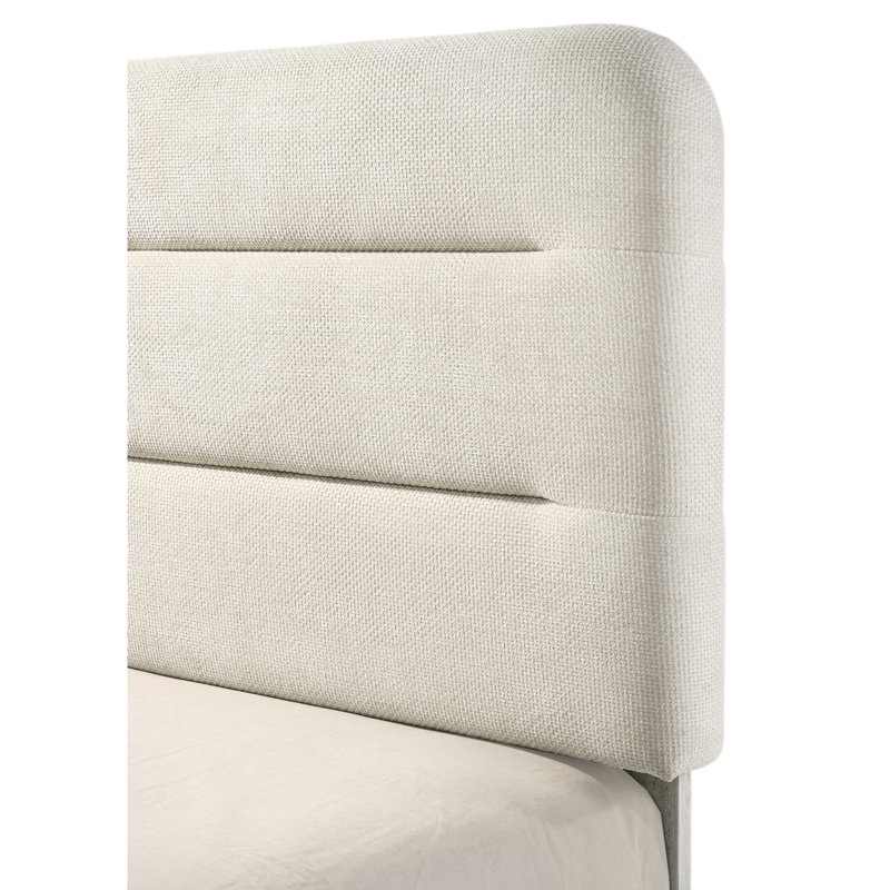 Lit à panneau moelleux rembourré avec des lignes épurées et un design polyvalent, idéal pour créer une chambre à coucher sereine et sophistiquée