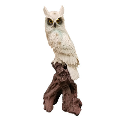 Statuette hibou blanc sur une branche