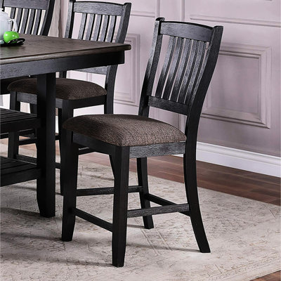 Deux chaises de bar couleur café foncé, assise rembourrée en tissu, style contemporain pour une cuisine raffinée, structure en bois d'hévéa, idéales pour un coin repas.