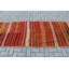 Tapis turc rayé en laine fabriqué à la main dans des tons rouges pour un décor bohémien et un tapis turc en tissu biologique