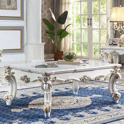 Table basse avec pieds à volutes