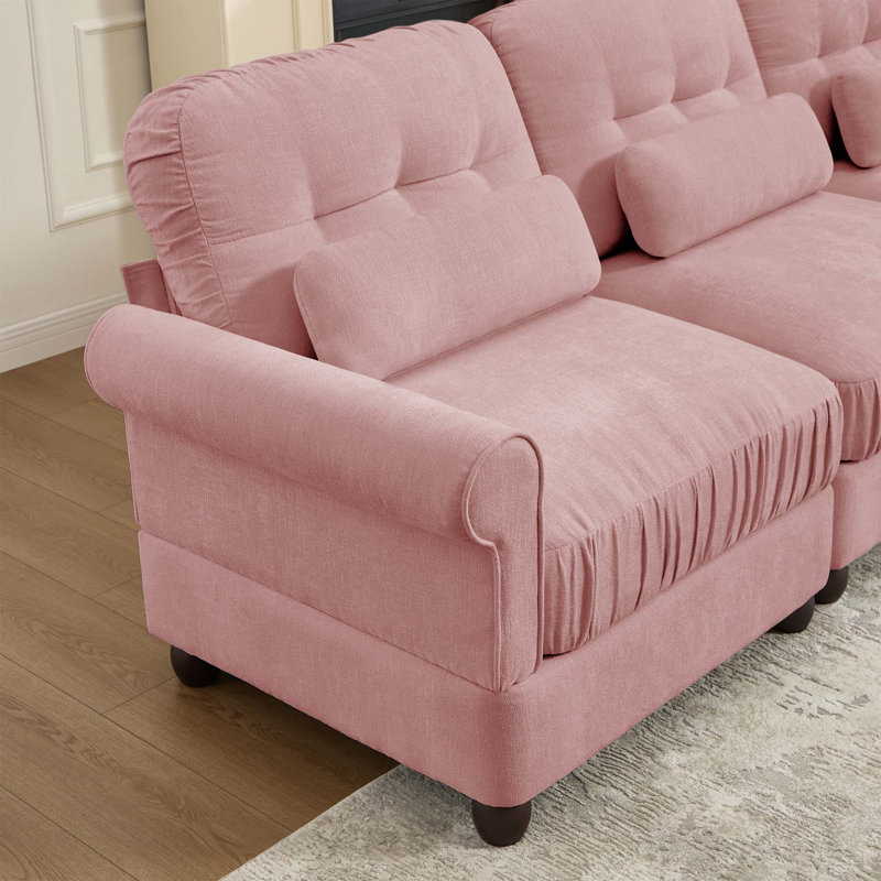 Canapé d'angle 3 places en chenille rose capitonnée avec pouf et accoudoirs arrondis