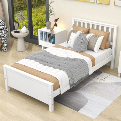 Lit plateforme simple en bois avec tête et pied de lit