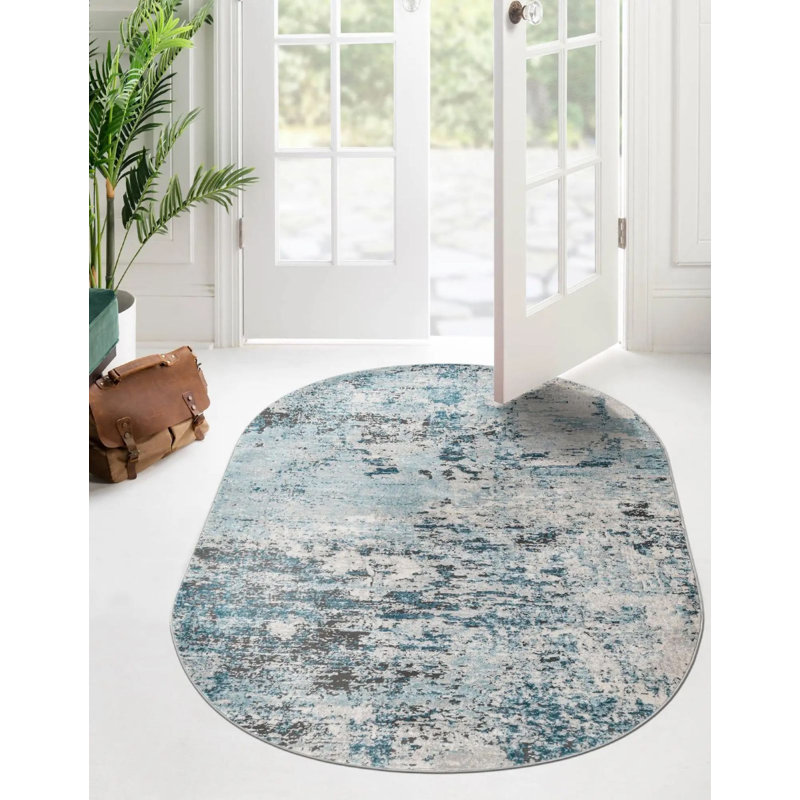 Tapis abstrait en polypropylène bleu / brun / gris tissé à la machine, Ovale 5 pi 3 po x 8 pi