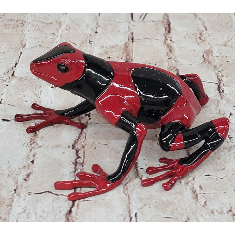 Figurine de grenouille rouge et noire
