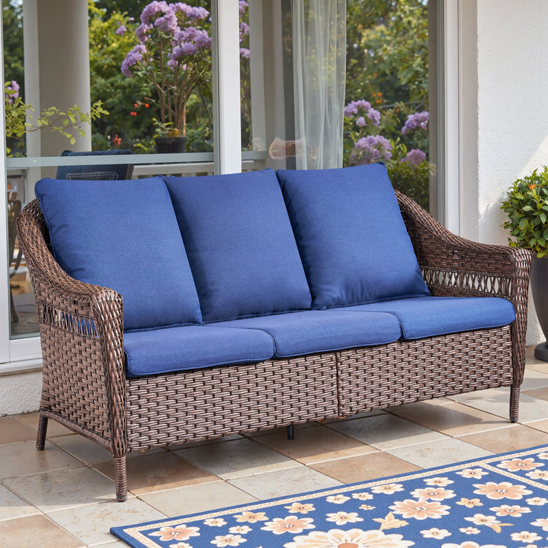 Canapé d'extérieur à dossier haut avec coussins Quirama, Coussin bleu / cadre brun