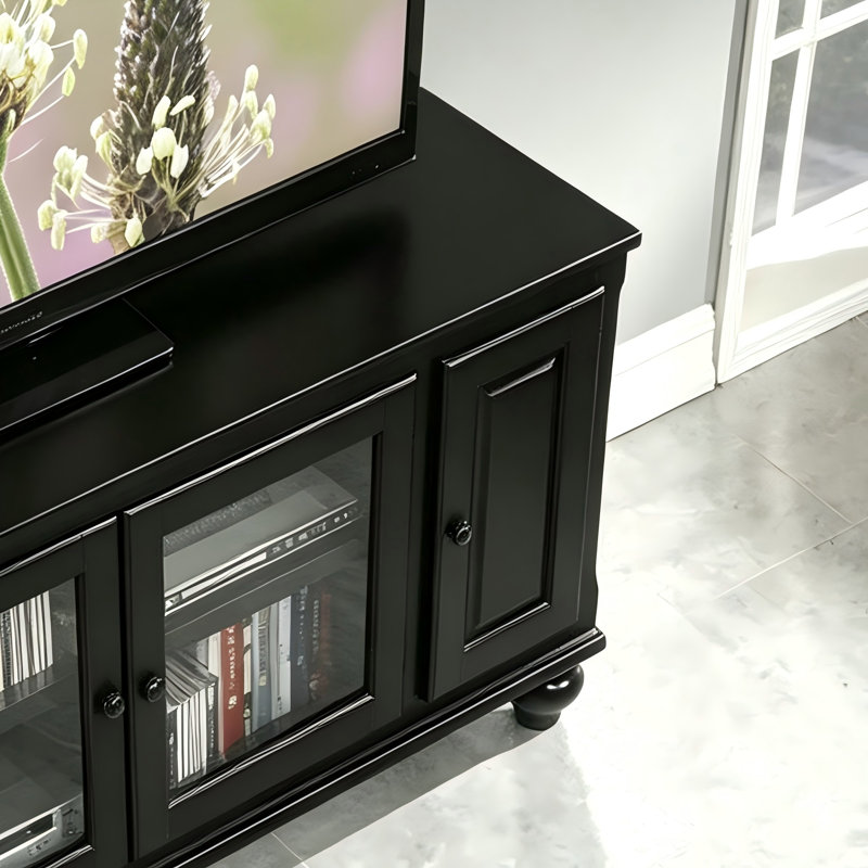 Meuble télé en bois noir avec placards de rangement fermés en verre et panneaux pleins