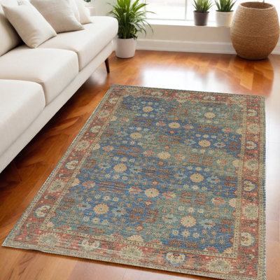 Tapis floral bleu et beige tissé à la main Doletha