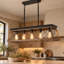 5-light farmhouse linear kitchen island chandelier with natural wood-look and brown finish