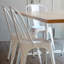 Chaise de salle à manger empilable à dossier en lattes de métal Isaul-602325883