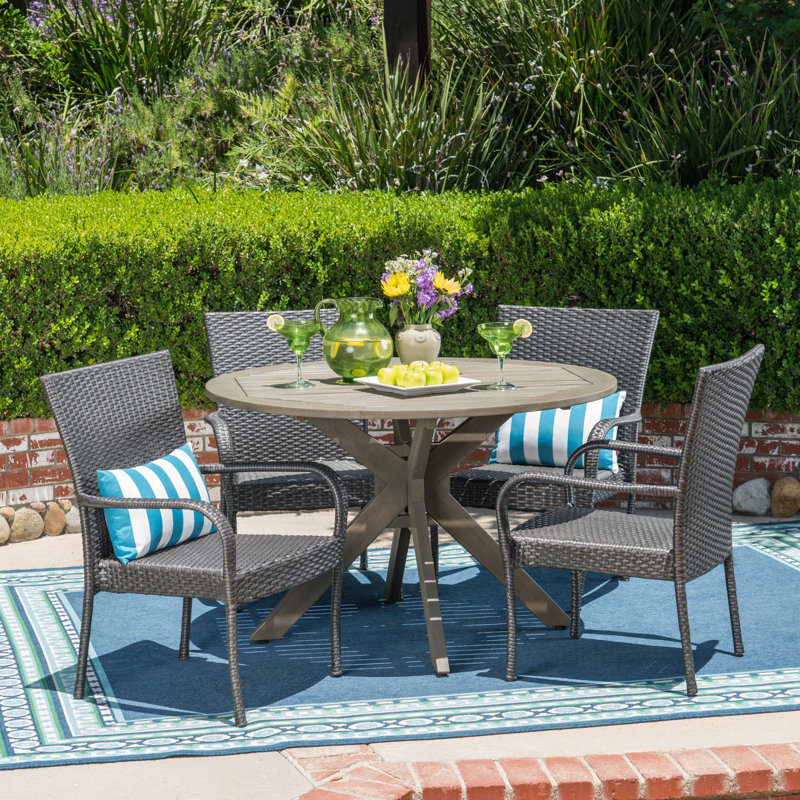 Thresher 4 - Person Acacia Wicker Patio Dining Set with Round Table