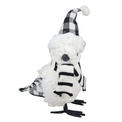 Oiseau, chapeau et écharpe