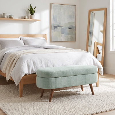 Repose-pieds ovale avec rangement en tissu plissé, pieds en bois d'hévéa massif et intérieur spacieux - Repose-pieds polyvalent, sièges supplémentaires et pièce décorative
