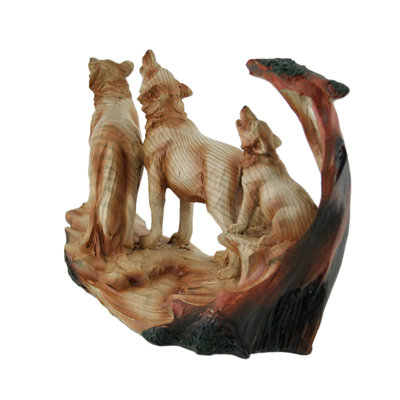Figurine rustique en résine coulée à froid représentant une famille de loups hurlants, aspect bois sculpté, 15 cm de haut.