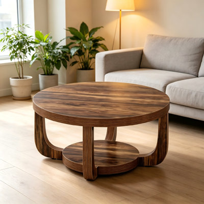 Cette table basse ronde multifonctionnelle pour le salon dispose de compartiments de rangement intégrés et peut être utilisée de manière flexible comme table d'appoint avec canapé ou table basse décontractée.