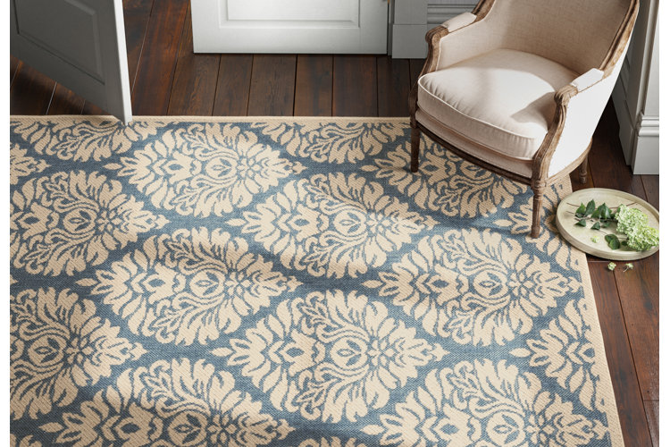 blue-and-green damask area rug