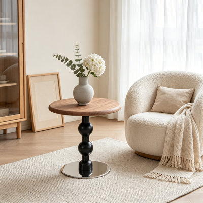 Table d'appoint ronde moderne sur pied central, plateau en placage de noyer avec pied en fuseau noir tourné et base en acier inoxydable