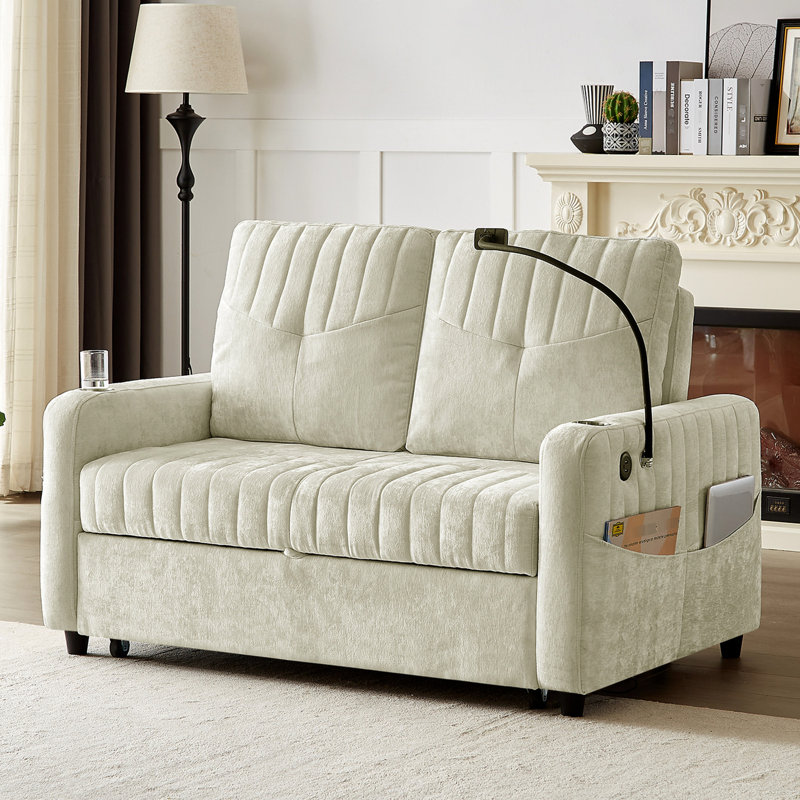 Lit réglable beige avec porte-gobelets, support pour téléphone, ports de chargement et rangement latéral pour les loisirs. Option de siège confortable de 53,9 po
