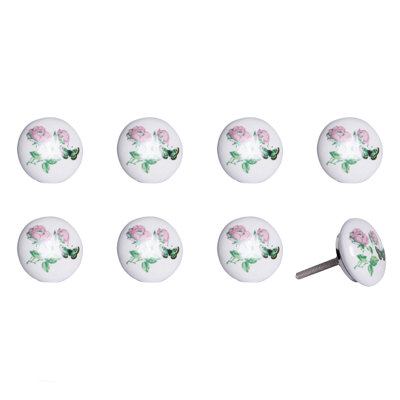 Ensemble de huit boutons de tiroir floraux en céramique et métal rose clair et blancs