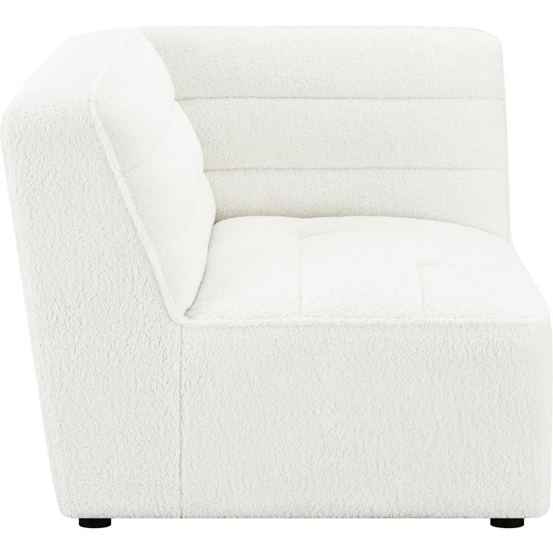 Fauteuil d'angle doux et modulaire, ajoutant du confort à l'espace de vie