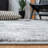 Leonaldo Abstract Machine Made Power Loom Polypropylene Area Rug in Gray/Black-1123611087