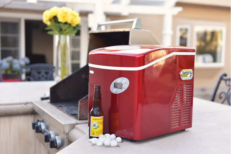 glossy red portable ice maker on a kitchen counter
