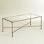 Table basse moderne en verre avec cadre en métal doré