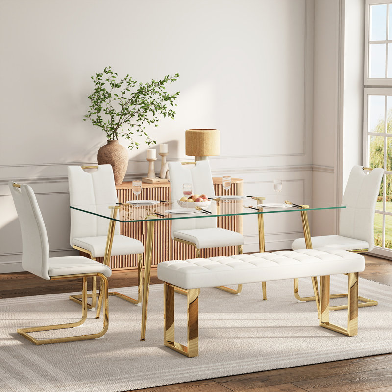 Ensemble de salle à manger en verre pour 4 à 6 personnes, de style moderne, comprenant une table de cuisine rectangulaire en verre, des chaises rembourrées en similicuir et un banc.