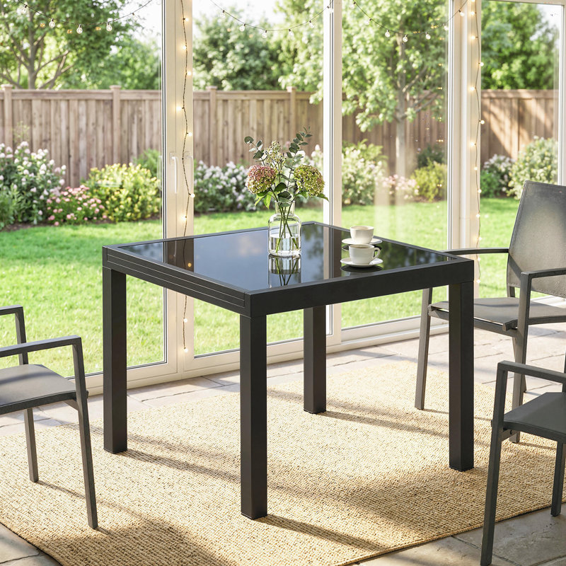 Table de salle à manger extensible pour l'extérieur avec plateau en verre trempé noir