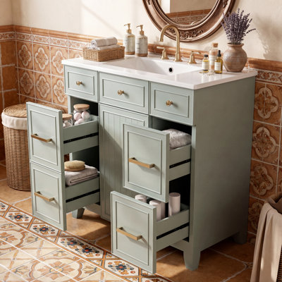 Meuble-lavabo de salle de bain de 91 cm (36 po) avec cadre en bois massif blanc, lavabo en céramique, portes à fermeture amortie, étagères réglables et 3 tiroirs dont un tiroir à double profondeur compatible avec un sèche-cheveux.