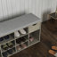 Banc de rangement multifonctionnel pour hall d'entrée avec coussin rembourré, tiroir et compartiments ouverts pour chaussures et accessoires