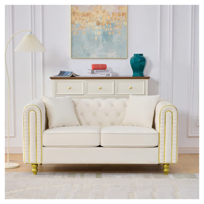 Canapé deux places en velours beige de 160 cm avec accoudoirs arrondis et pieds dorés