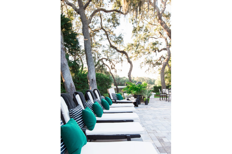 lounge chairs await by the pool