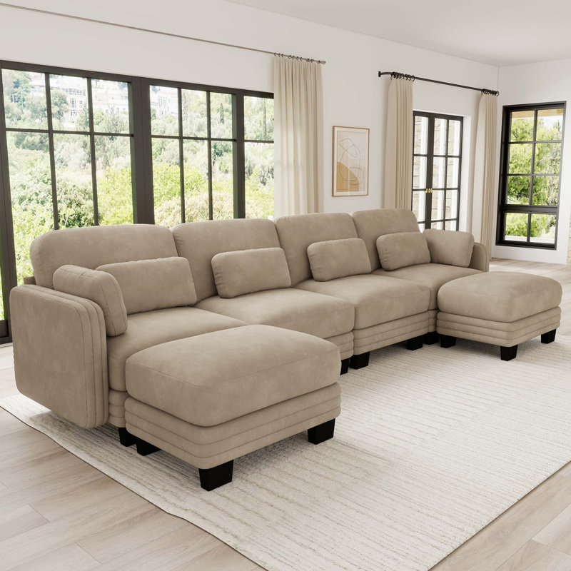 Canapé d'angle modulaire capitonné avec poufs amovibles