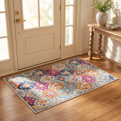 Tapis rose à motif abstrait Kymiere