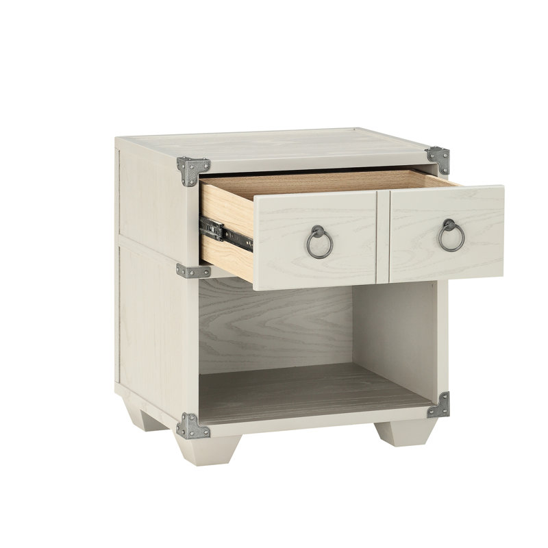 Table de chevet grise avec des matériaux et une touche moderne dans un mouvement de pieds lisse