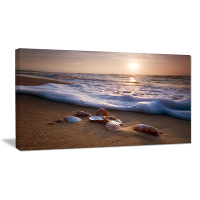 " Waves Approaching Seashells On Sand "