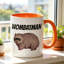 A Ceramic Coffee Mug Featuring a Wombat Logo, Perfect for Enjoying Tea, Milk, Or Water.