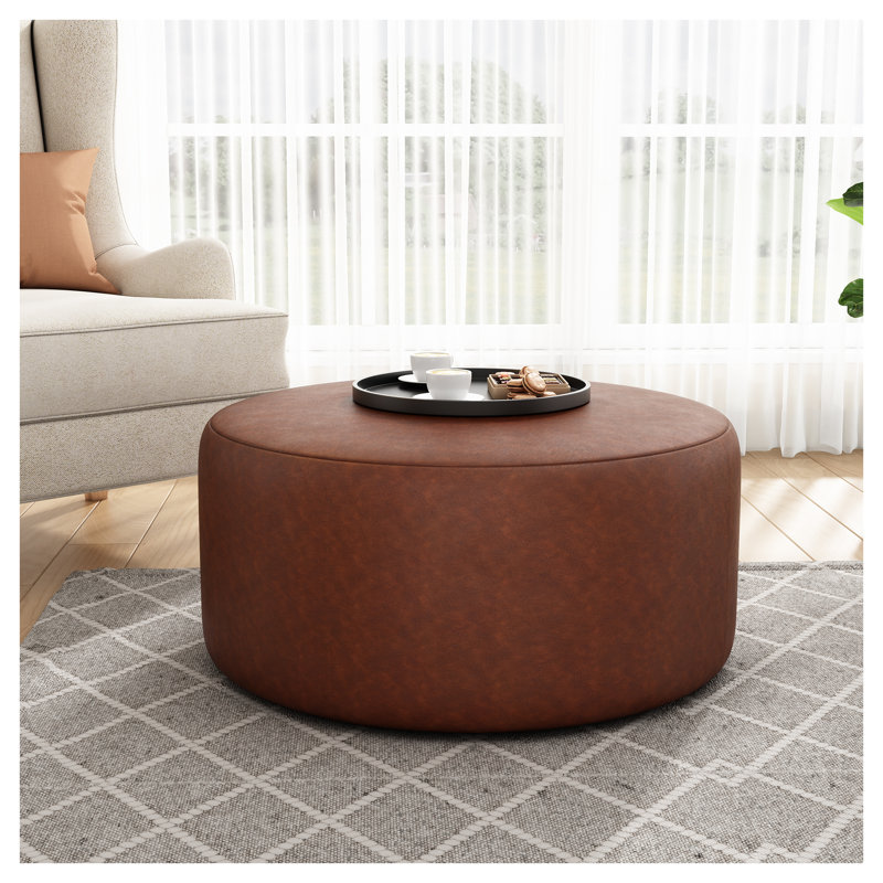 Repose-pieds rond en cuir de polyuréthane, repose-pieds rembourré brun avec design moderne - Table basse de salon multifonctionnelle et sièges supplémentaires