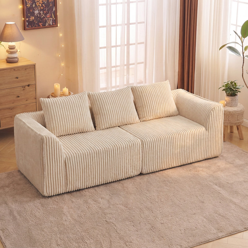 Canapé incurvé modulaire avec coutures capitonnées et bords enveloppés, Beige