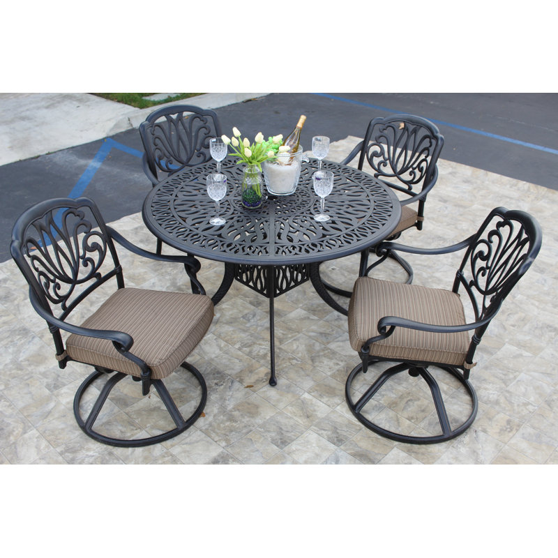Waynesville 4 - Person Patio Dining Set with Round Table , Cushions Included