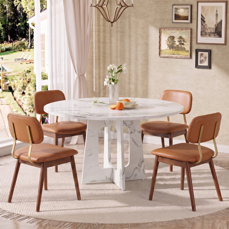 Ensemble de salle à manger moderne 5 pièces en MDF avec fini marbre blanc et chaises en cuir rembourrées.