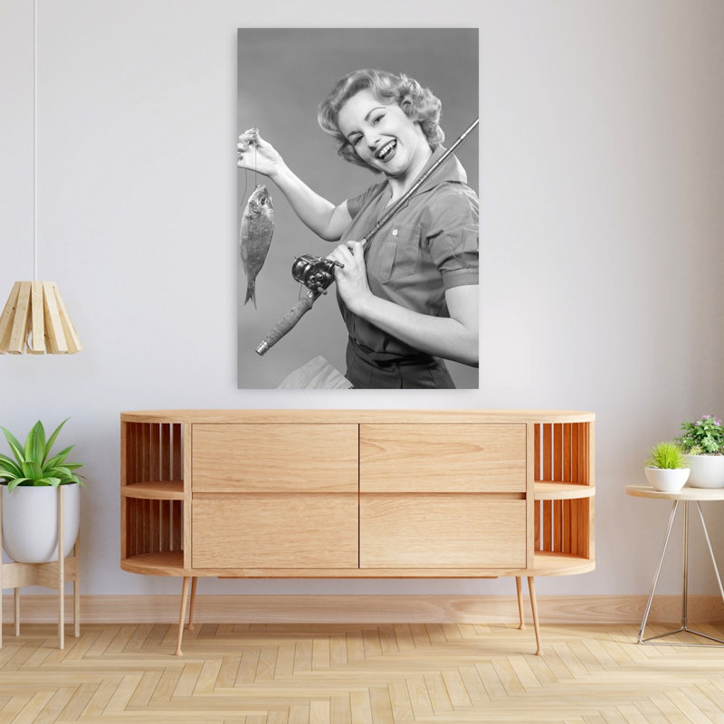 1950S Smiling Woman With A Fishing Rod Over Her Shoulder Holding Up A Fish Looking At Camera Classic Retro Vintage Fish Animal Portrait Wall Art