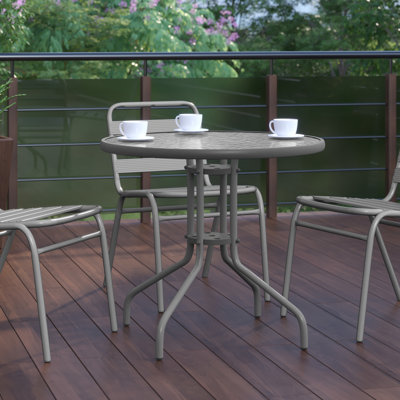 Amlie 31.5" Round Tempered Glass Metal Table with Smooth Ripple Design Top by Wade Logan